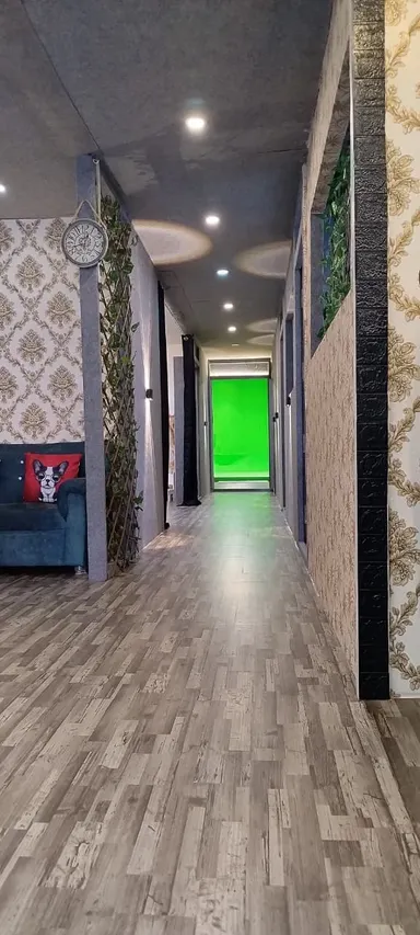 Production-Friendly Studio with Green Screen and Podcast Setup image 5