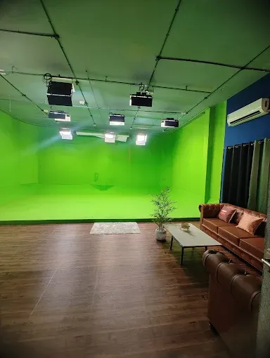 Production-Friendly Studio with Green Screen and Podcast Setup image 3